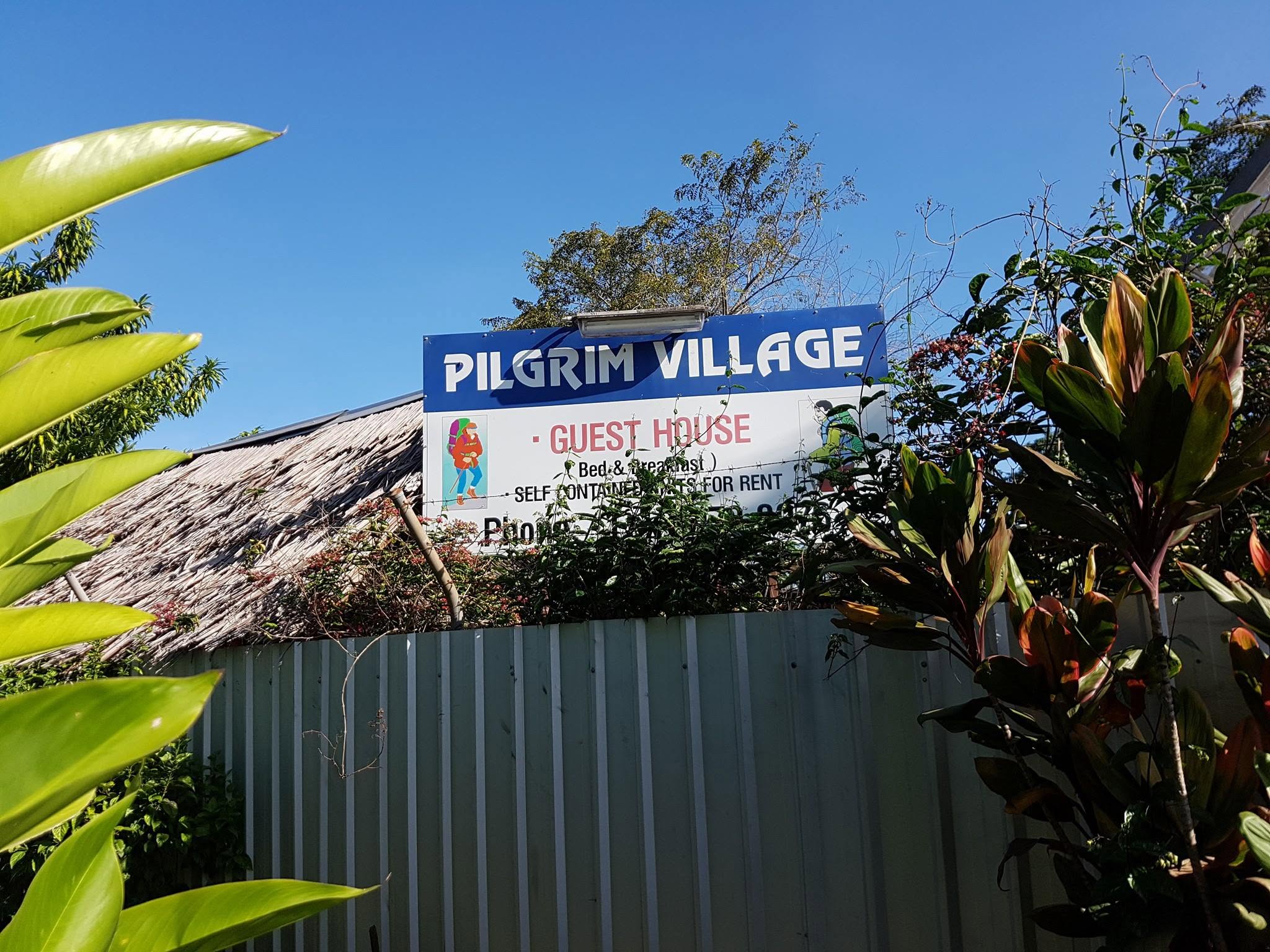 Pilgrim Village guest house sign